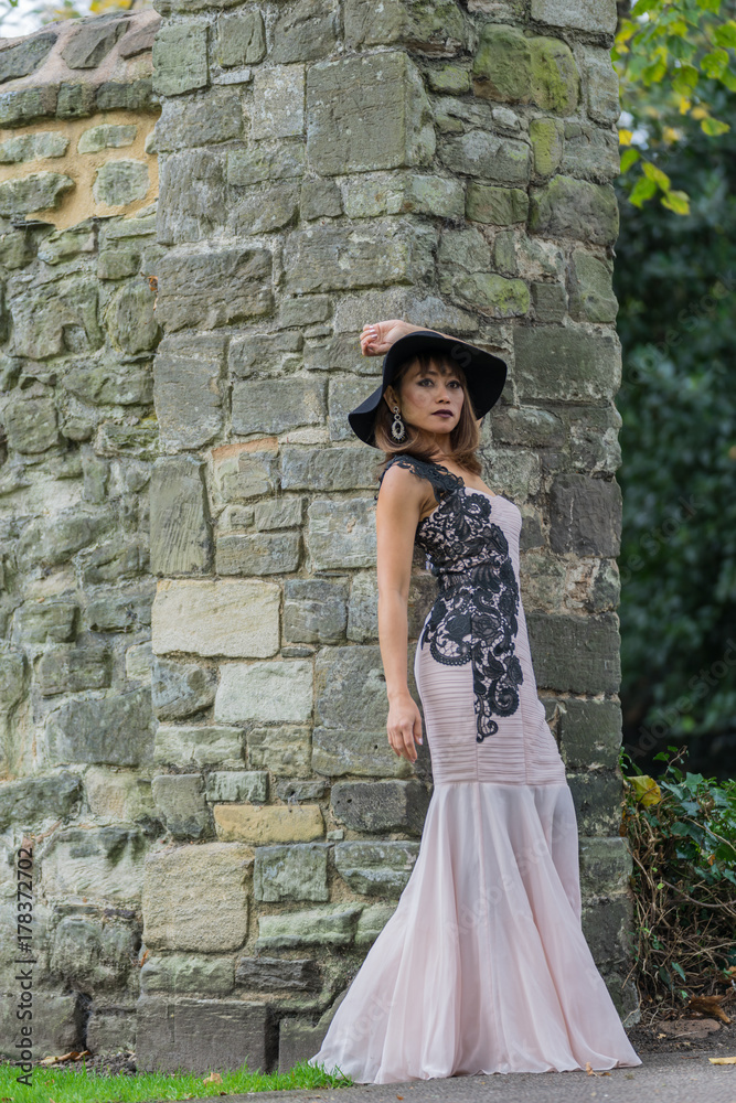 Filipino model in a local park at Autumn time surrounded by lush foliage at daytime Filipino model in a local park at Autumn time surrounded by lush foliage at daytime