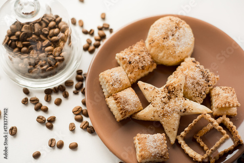 Christmas cookies, Christmas spices and dried orange slices on white background photo