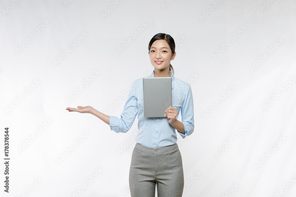 Businesswoman use tablet and finger point up Businesswoman use tablet and finger point up