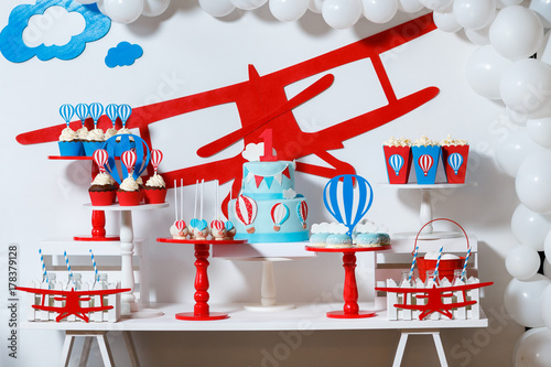 Canvas Print Candy bar on boy's birthday party with a lot of different candies, popcorn, beverages and big cake