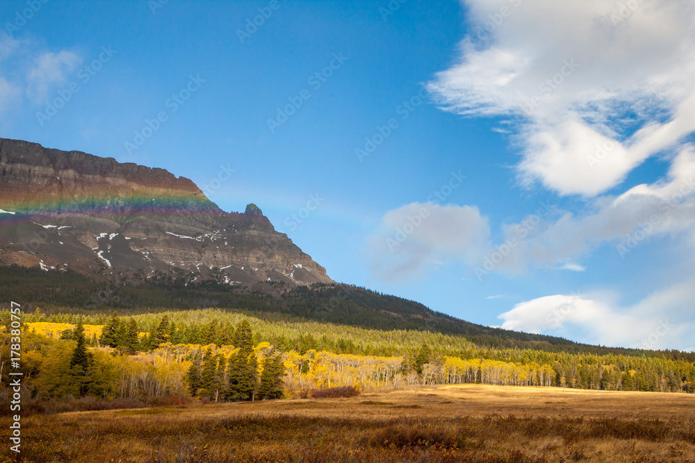 Rainbow on an autumn day in front of a mountain near Saint Mary 
