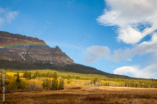 Rainbow on an autumn day in front of a mountain near Saint Mary 