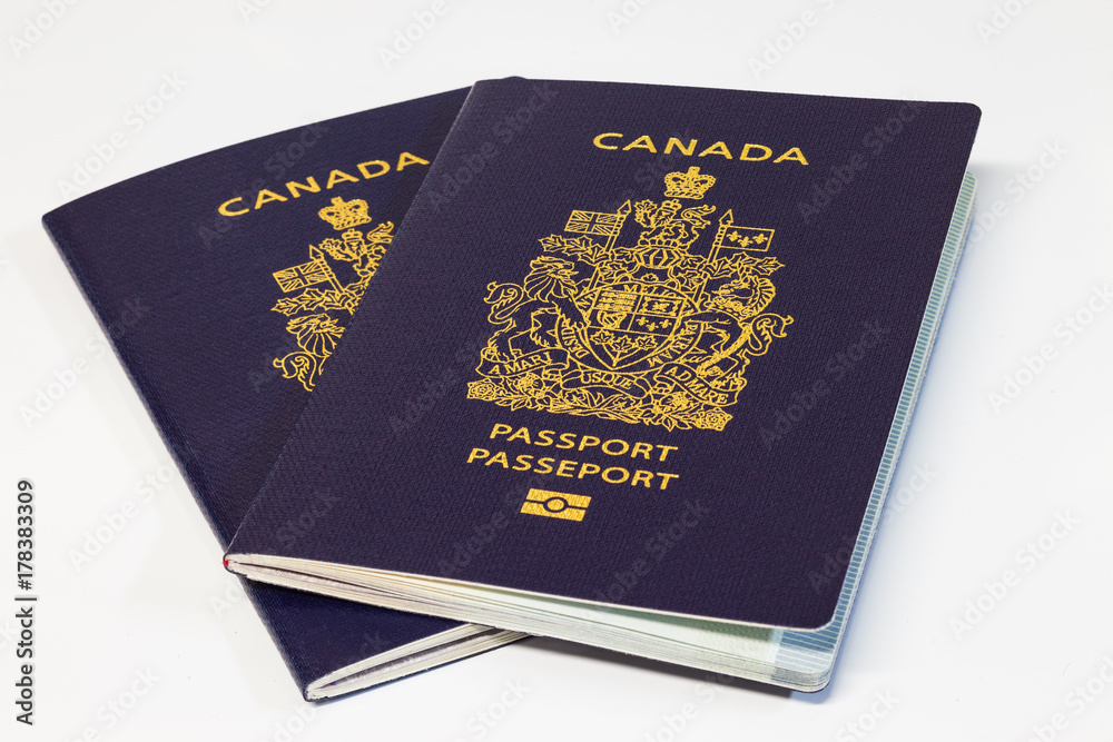 Two Canadian passports on white background Two Canadian passports on white background