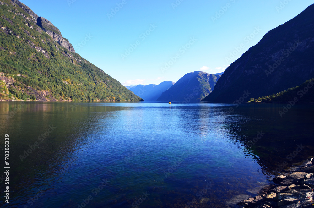 Blue water of Geirangerfjord as seen from the town Hellesylt, More og Romsdal, Norway