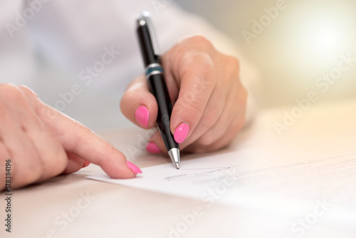 Woman signing a contract  light effect