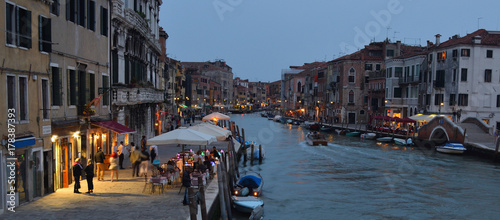 Cannaregio Canal  early  evening with  illuminated restaurants and bars Venice. photo