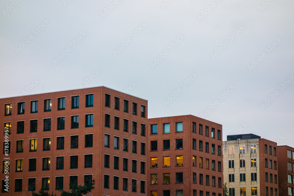 typical brick office buildings on a cloudy background