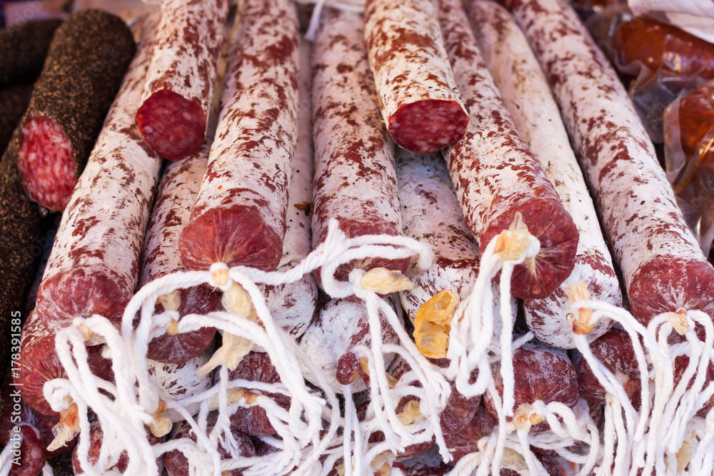 Close-up of Spanish meat sausages (salchichon and fuet) for sale at Sineu market, Majorca, Spain
