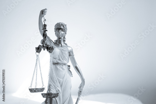 Woman statue symbol of justice Themis