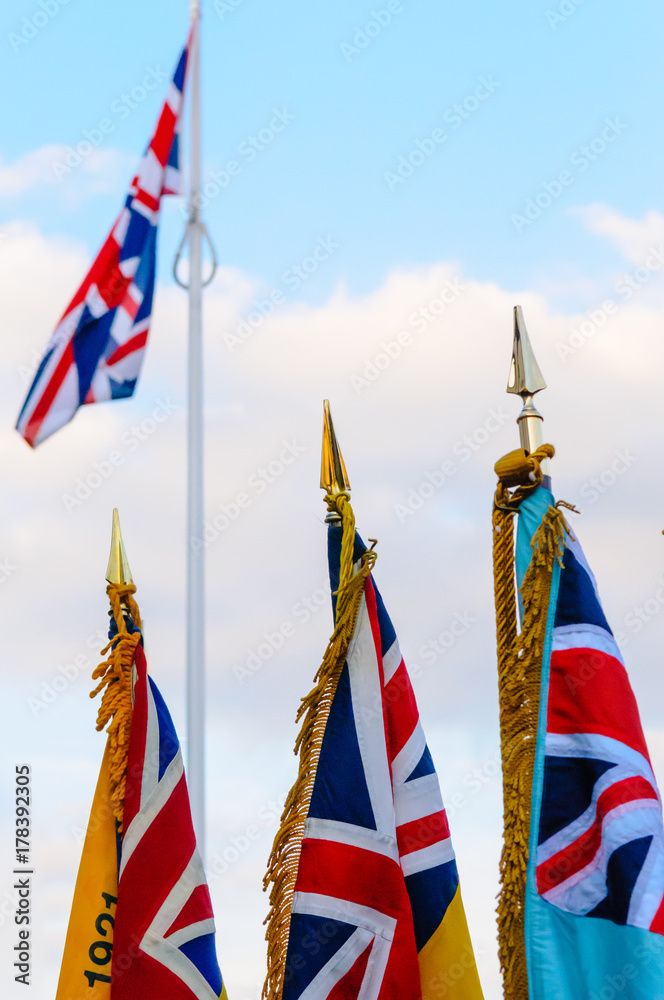 Royal British Legion flags and standards in front of a Union Flag Royal British Legion flags and standards in front of a Union Flag
