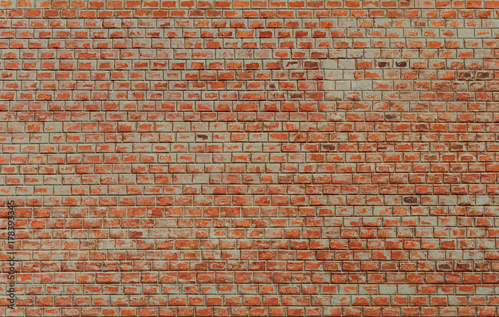 Naklejka premium Dirty red brick wall background