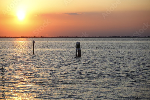 tramonto al mare con briccola  photo