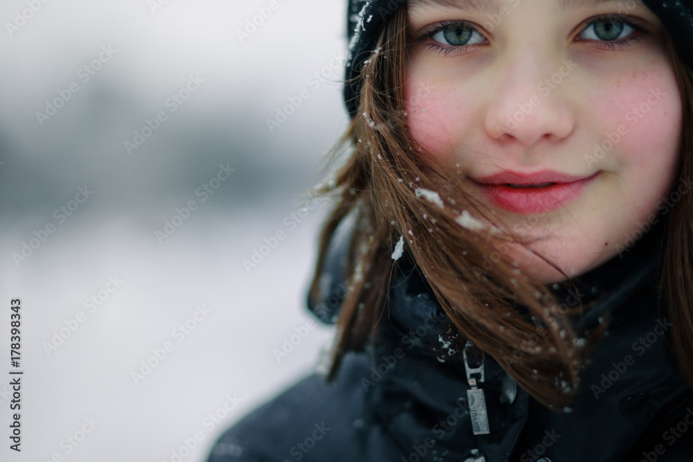Beautiful girl teen smiles in winter Beautiful girl teen smiles in winter