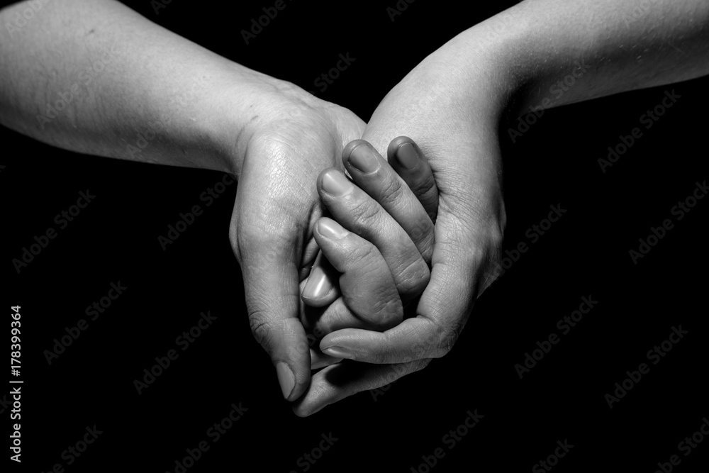 Fototapeta premium hands in mudra gesture on black background