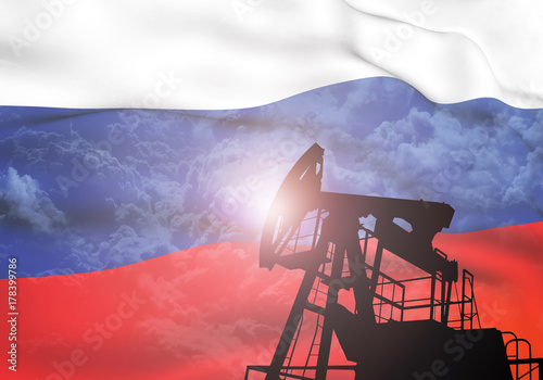 Oil pump on background of flag of Russia photo