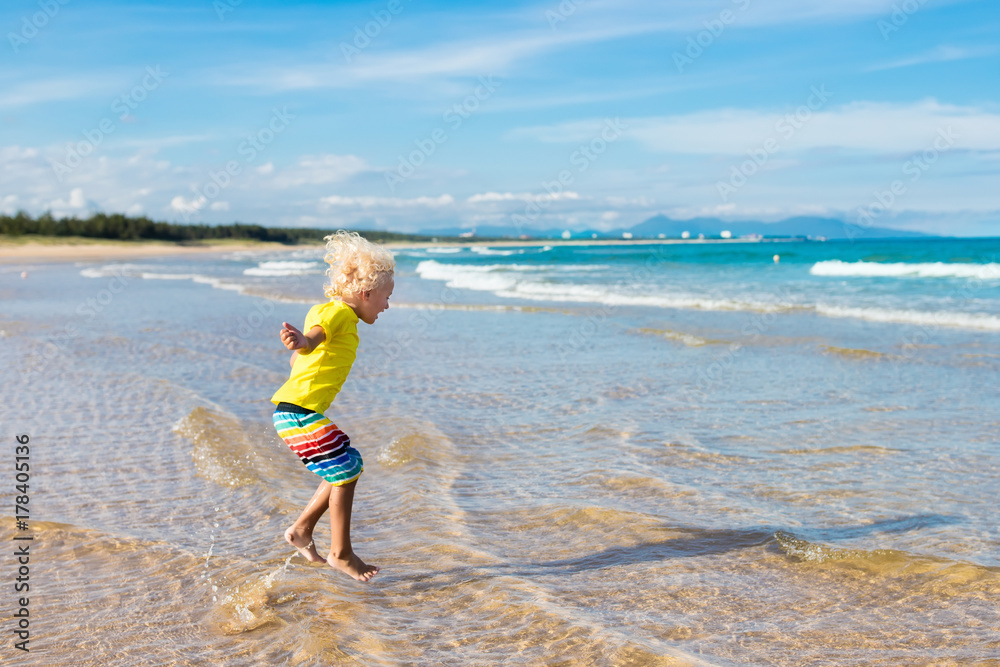 Child on tropical beach. Sea vacation with kids. Child on tropical beach. Sea vacation with kids.