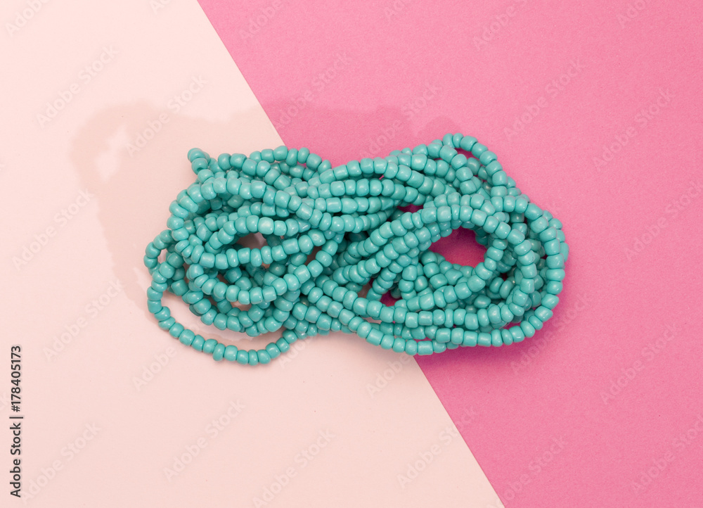Fototapeta premium Bead Neckless on a Duel Colored Background