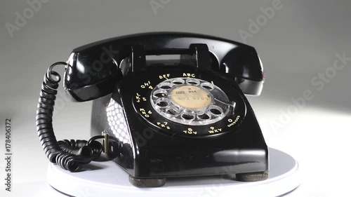 Old style black telephone rotating.