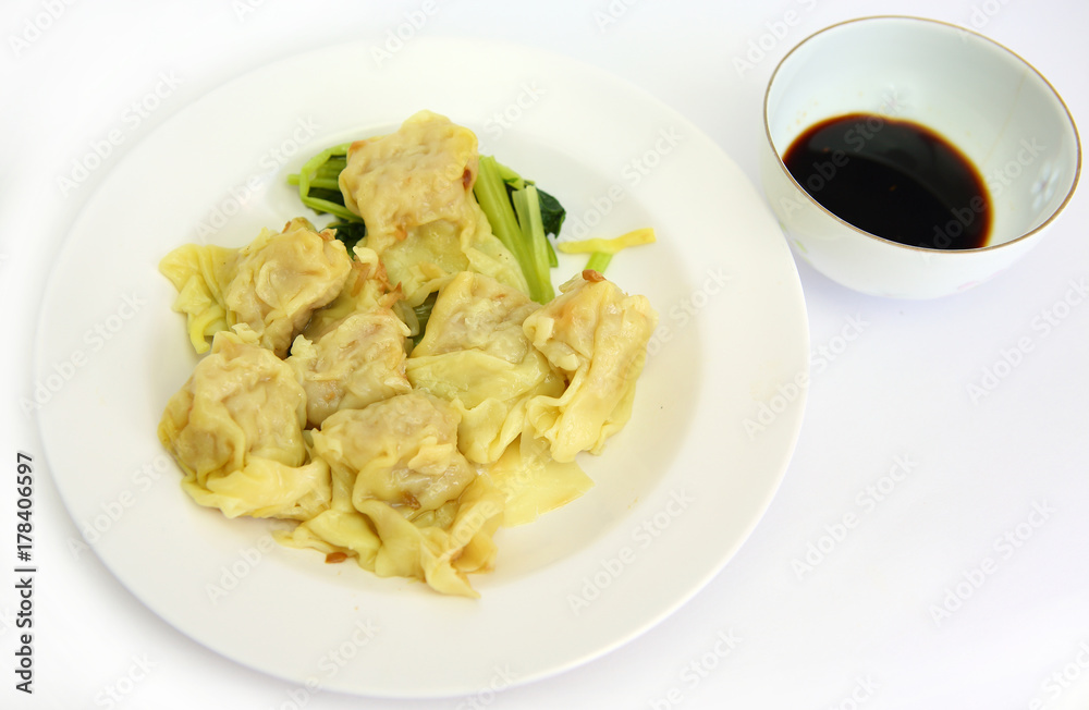 Dumplings on white plate with sweet sauce. Dumplings on white plate with sweet sauce.
