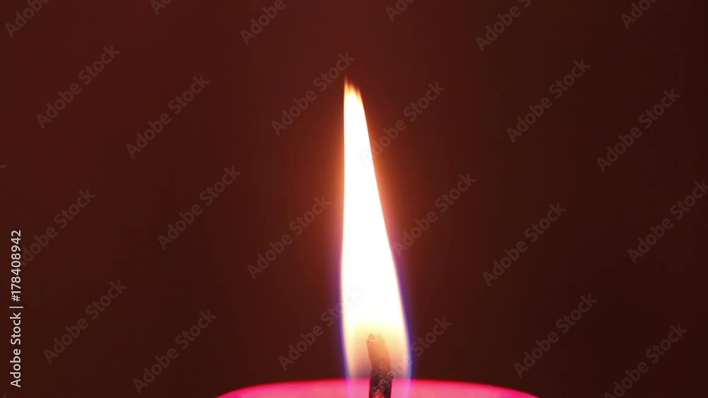 burning red wax candle. macro shooting burning red wax candle. macro shooting