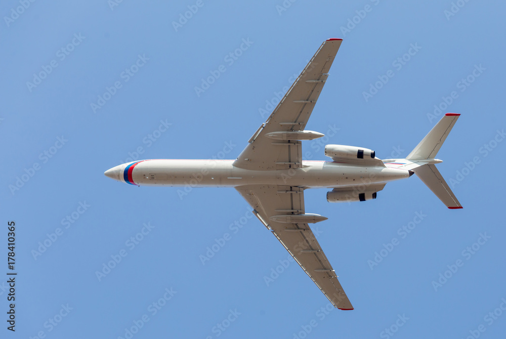 Commercial jet aircraft in blue sky. Airplane's fuselage. Aviation and transportation. Commercial jet aircraft in blue sky. Airplane's fuselage. Aviation and transportation.