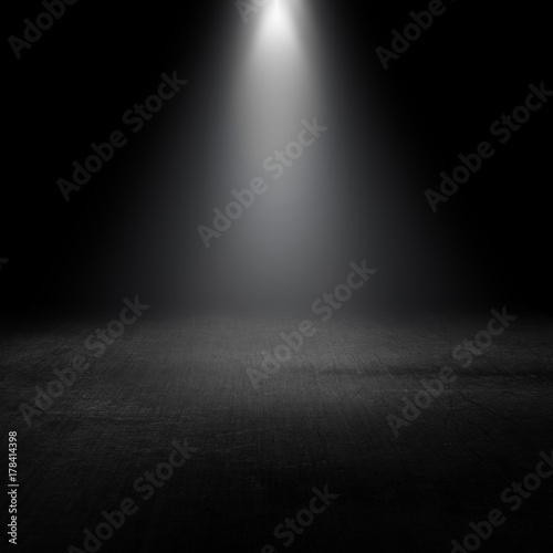 spotlight shining down into a grunge interior