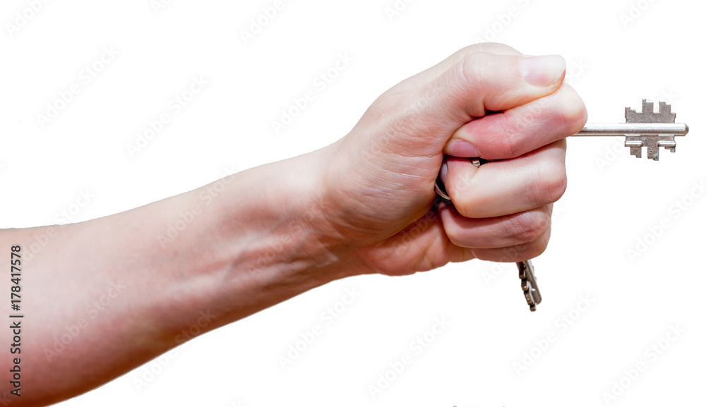 Female fist with clipped keys. Using of improvised stuff (door keys) for protection. The blow with such fist will cause more damage. Self-defense concept. Isolated on white background. Female fist with clipped keys. Using of improvised stuff (door keys) for protection. The blow with such fist will cause more damage. Self-defense concept. Isolated on white background.