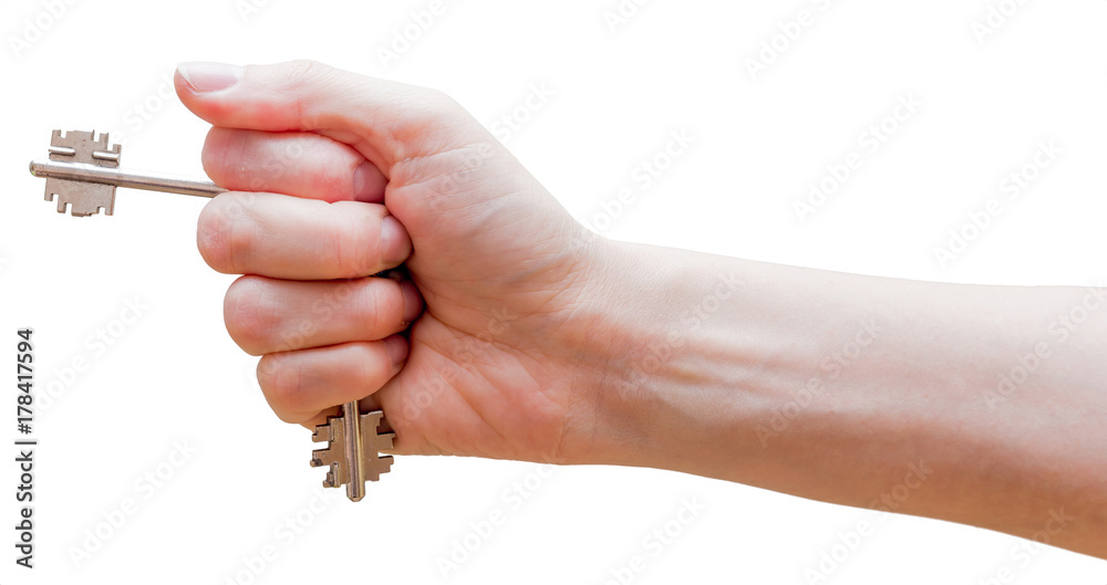 Female fist with clipped keys. Using of improvised stuff (door keys) for protection. The blow with such fist will cause more damage. Self-defense concept. Isolated on white background. Female fist with clipped keys. Using of improvised stuff (door keys) for protection. The blow with such fist will cause more damage. Self-defense concept. Isolated on white background.