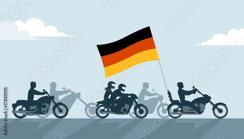 German bikers on motorcycles with national flag