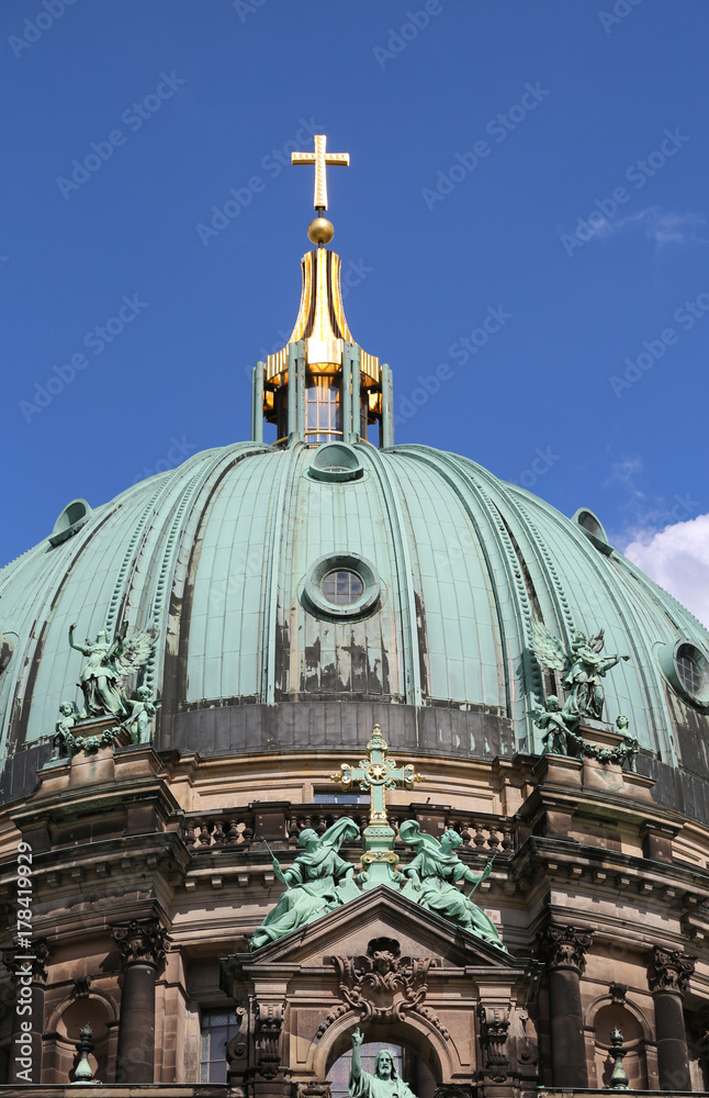 golden cross over the dome of the cathedral in Baroque style Berlin Germany golden cross over the dome of the cathedral in Baroque style Berlin Germany