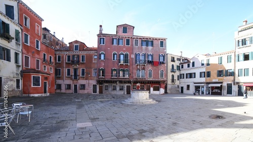 wide square in Venice Italy and the ancient well