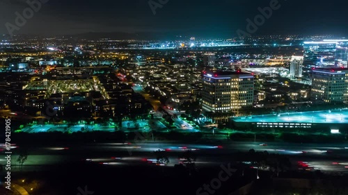 Wallpaper Mural Aerial timelapse in motion or hyperlapse at night along the urban California I-405 interstate with cars, traffic and high-rise buildings below. Torontodigital.ca