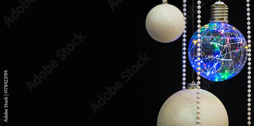 isolated christmas balls with garlands on a black background for Christmas cards  greetings  New Year illustrations