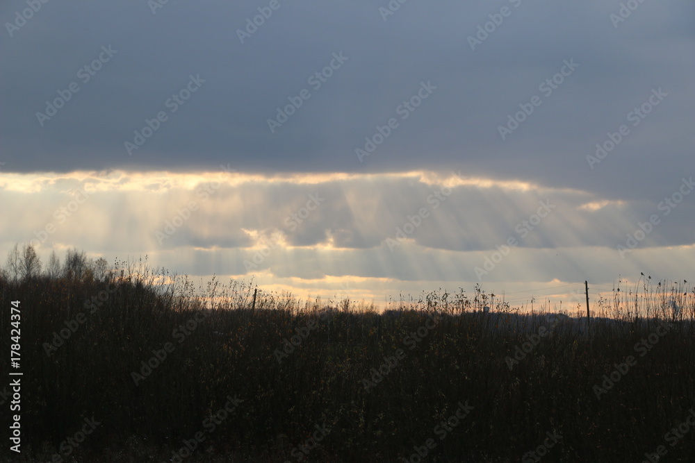 The sky with large clouds and the rays of the sun between them. The sky with large clouds and the rays of the sun between them.