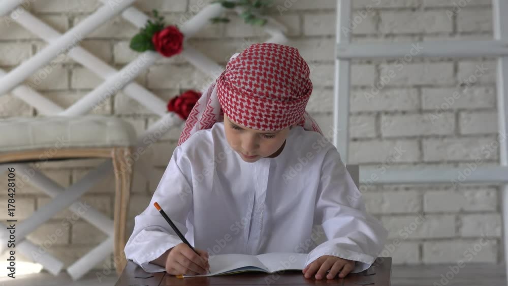 Little arabic boy studying at school. Little arabic boy studying at school.