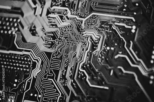 Computer hardware. Close Up electronic circuit board background black and white.