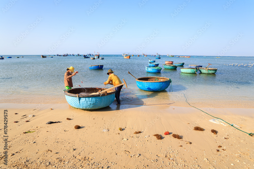Fishermen are collecting fish at My Hiep beach in early morning, Ninh Thuan, Vietnam. Ninh Thuan is famous for beautiful landscapes, majestic Cham towers and unique Cham culture. Fishermen are collecting fish at My Hiep beach in early morning, Ninh Thuan, Vietnam. Ninh Thuan is famous for beautiful landscapes, majestic Cham towers and unique Cham culture.