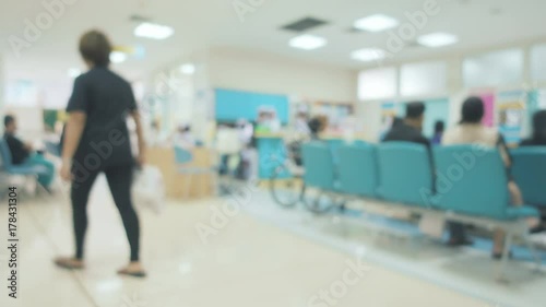 Blurred image of many people sitting on the chair in hospital