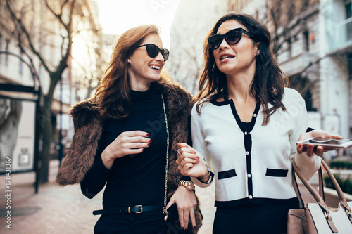 Female friends walking on the road