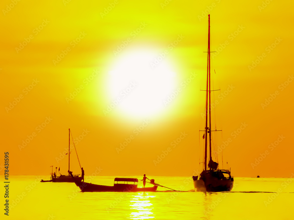 Fototapeta premium Silhouette of golden sunset and boat at sea background