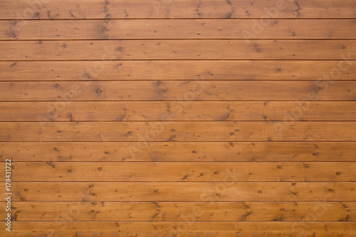 a brown wooden background consisting of an alloyed board