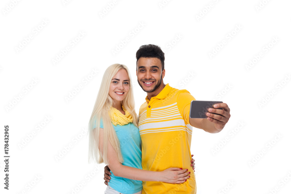 Beautiful Young Happy Couple Love Smiling Embracing Taking Selfie Photo On Cell Smart Phone, Hispanic Man Woman Isolated Over White Background Beautiful Young Happy Couple Love Smiling Embracing Taking Selfie Photo On Cell Smart Phone, Hispanic Man Woman Isolated Over White Background