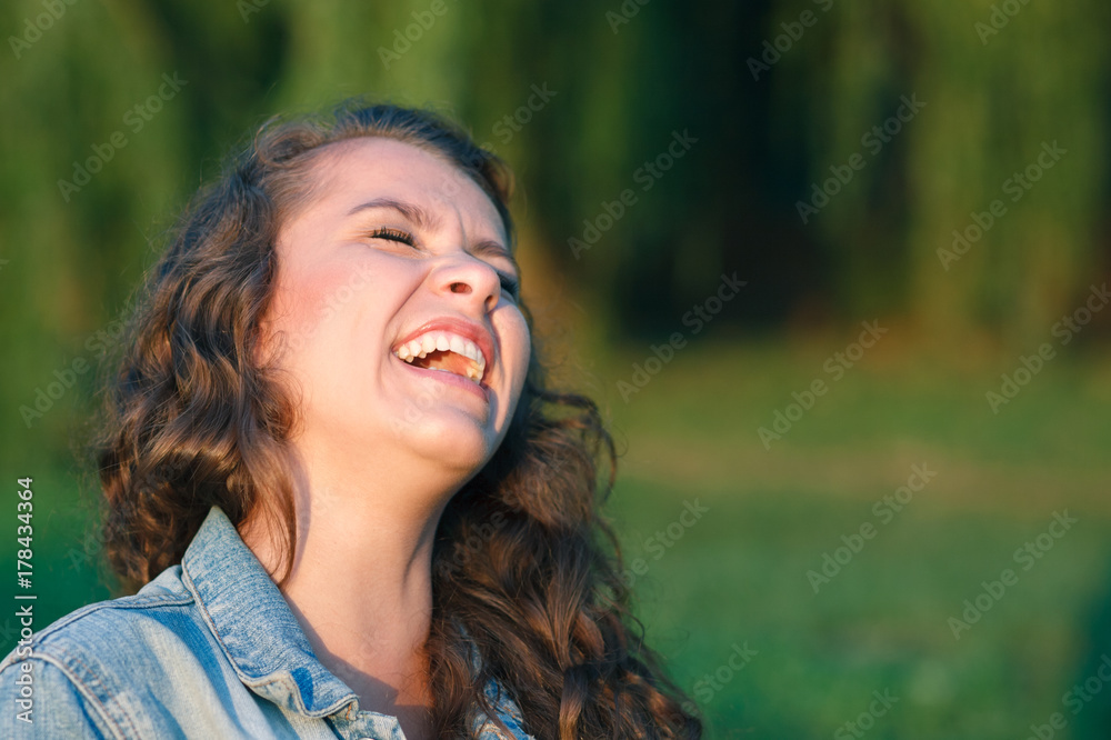 teenage girl laughing outdoor