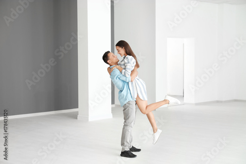 Happy young couple in their...