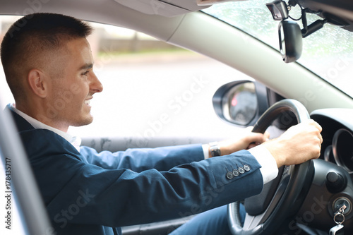 Handsome young businessman driving modern car © Africa Studio