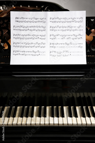 Music notes on black piano