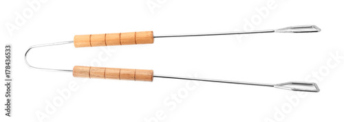 Foto Barbecue tongs with wooden handle on white background