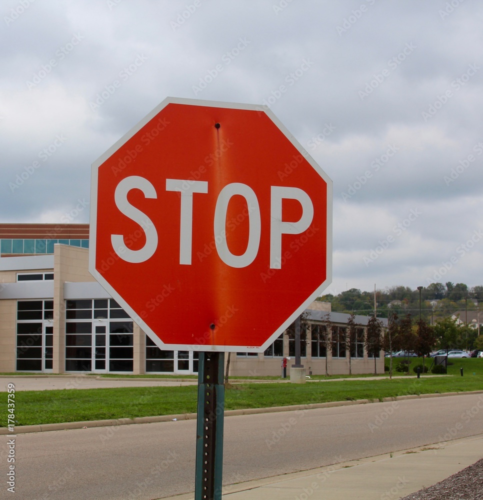 The red stop sign on a close up view.