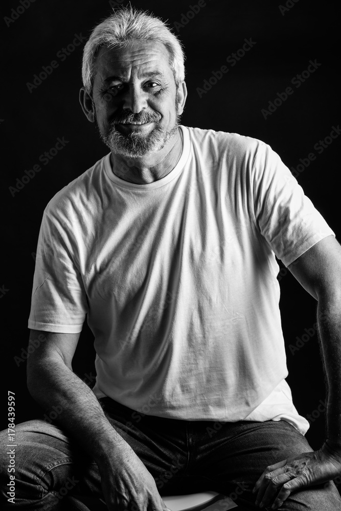 Fototapeta premium Mature man with white hair and beard smiling