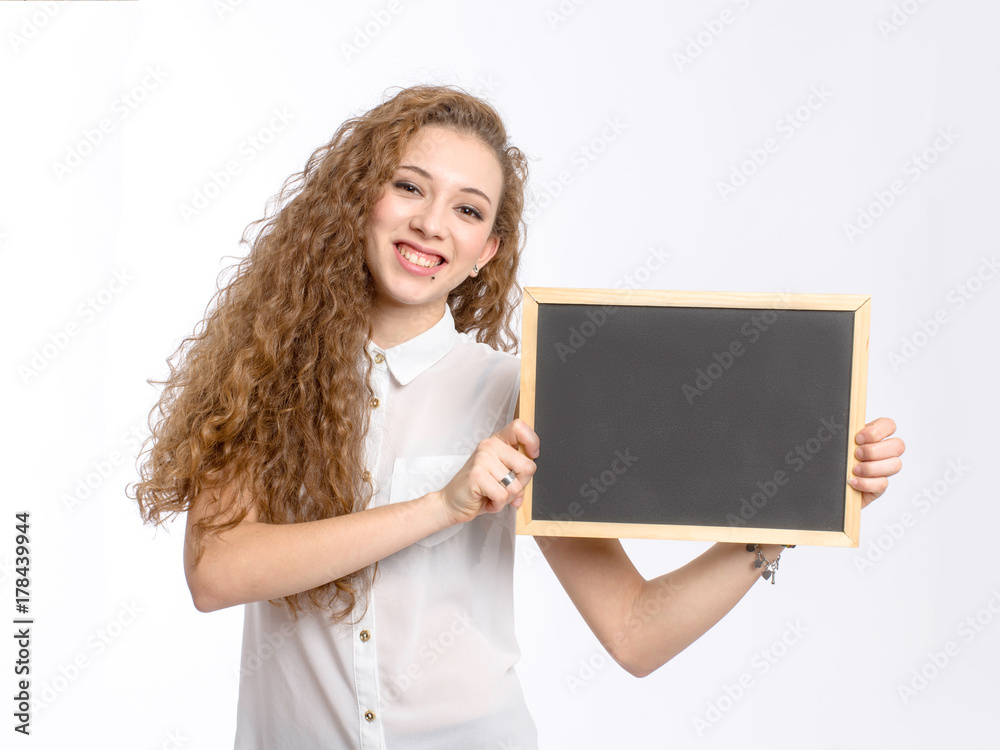Naklejka premium young girl with black chalkboard on white background
